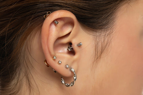 Can wearing of earrings or piercings be harmful?